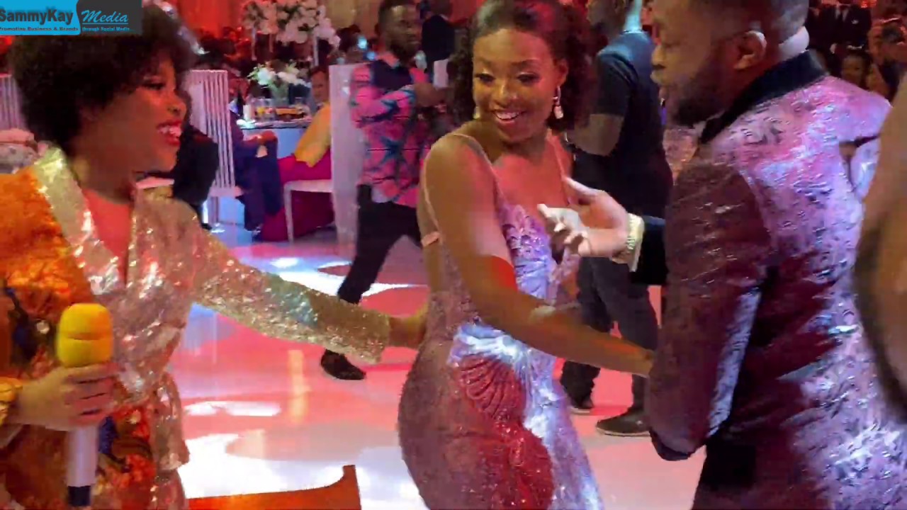 Despite on the dance floor with his son & wife at their extravagant wedding dinner