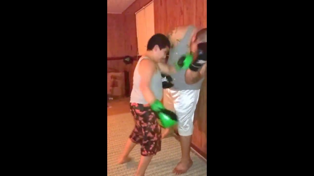 Father and son boxing : sparring session