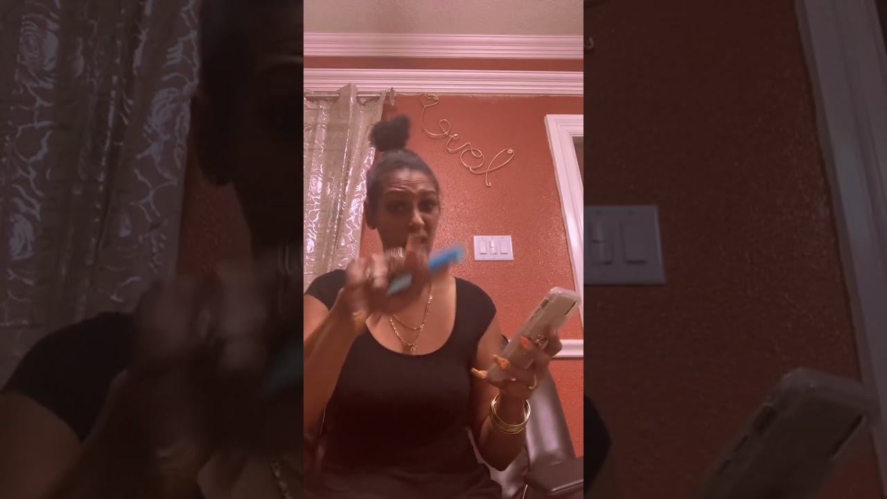 Outspoken woman expresses anger and shares colorful language in this animated moment.