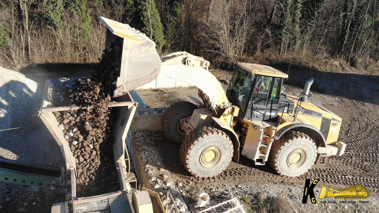 CATERPILLAR 980H WHEEL LOADER Feeding The REV Crusher and Truck