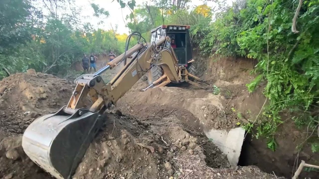 Setting Conctrete Cuverts Pipe Across Trail With The Caterpillar 420D