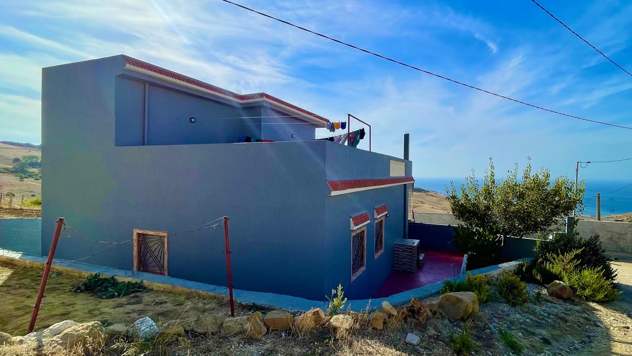 دار وغرسة راءعة مطلة على البحر واصل الماء والكهرباء 0703640826 القصر الصغير طنجة
