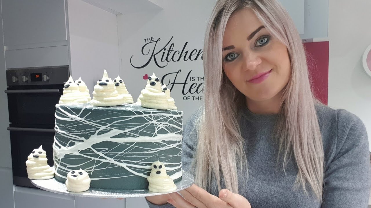 Marshmallow spiderweb cake decorating