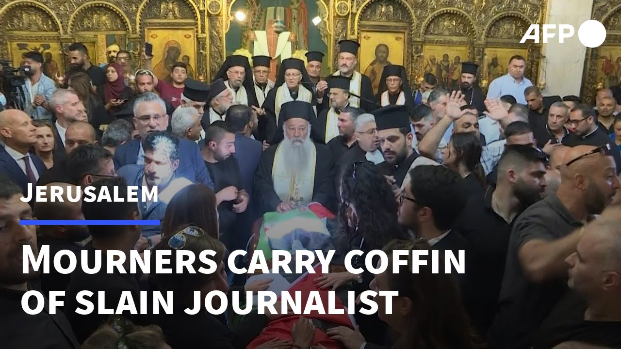 Palestinian mourners carry coffin of slain Al Jazeera journalist into Jerusalem church | AFP