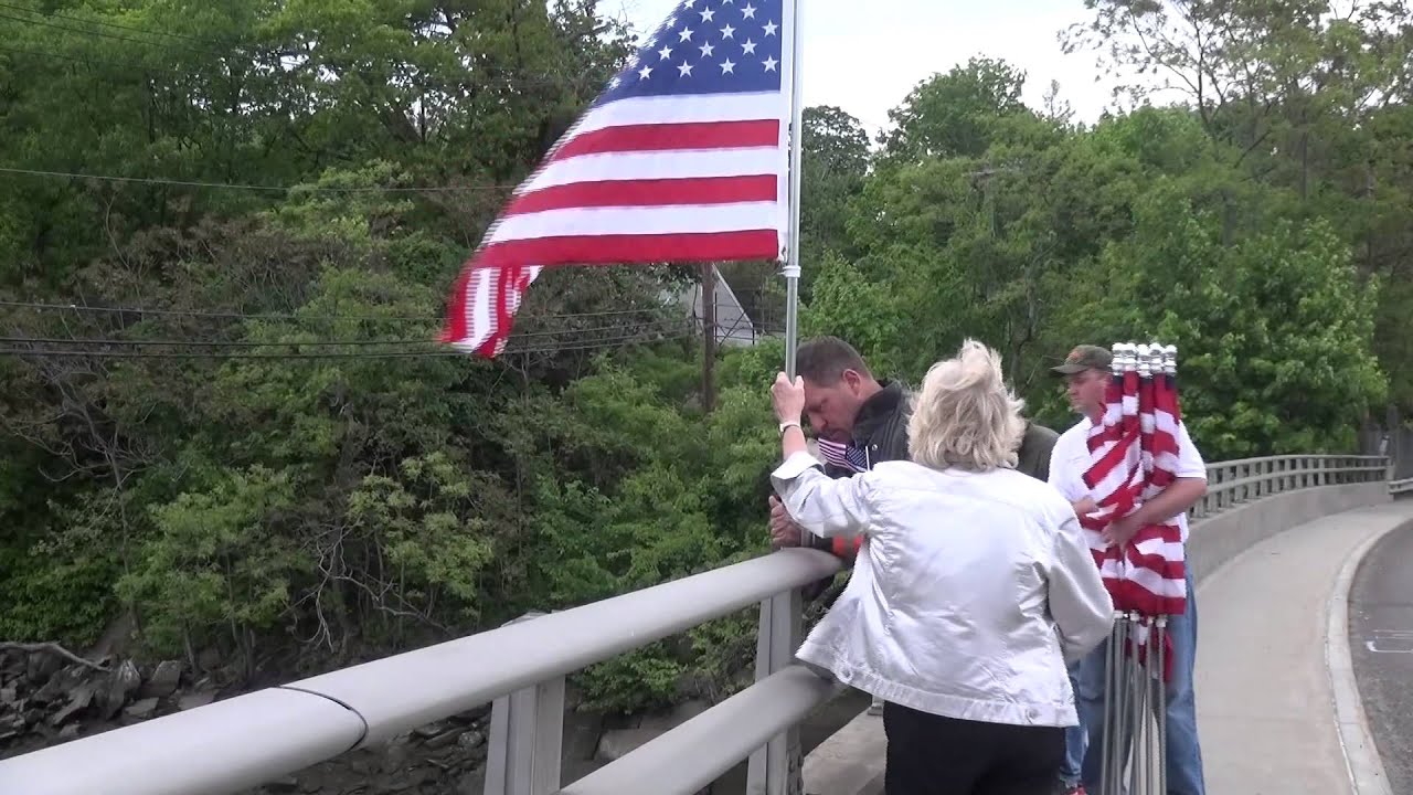 Flags Go Back Up on Route 1 Mianus River Bridge to Honor Theis