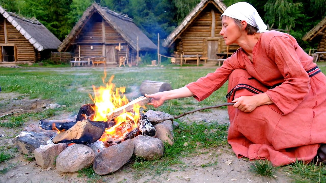 Firing spindle whorl in a bonfire