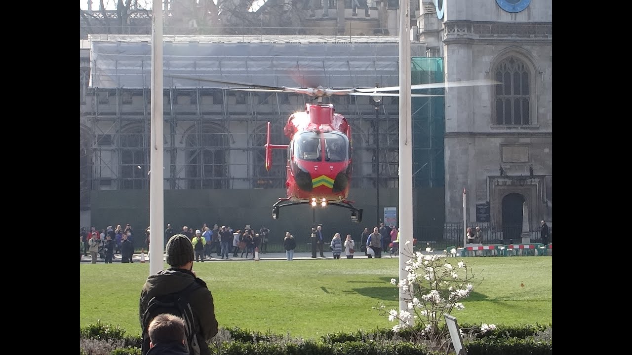 An Air Ambulance Helicopter taking off vertically from Parliament Square, London.