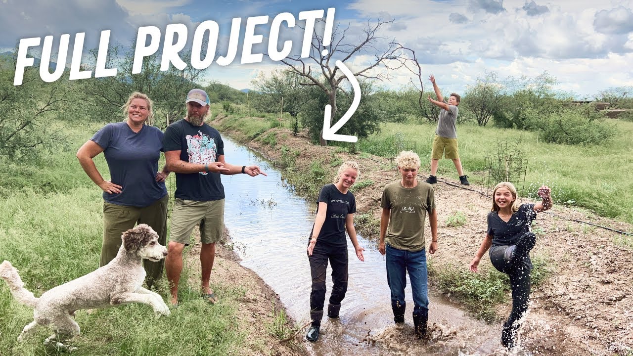 GREENING THE DESERT w/ RAINWATER? Off-Grid Family Builds Permaculture Berm & Swale, Plants Trees