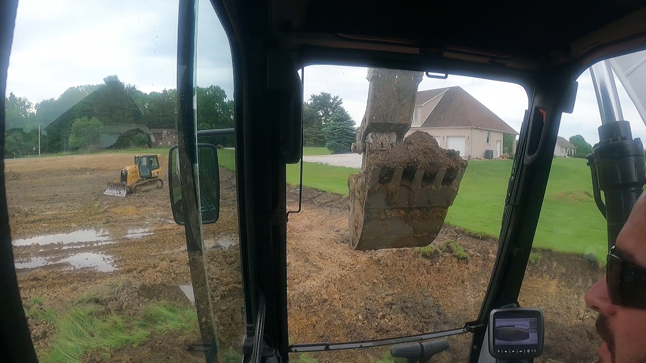Bobcat e165 and kobelco 160 digging pond
