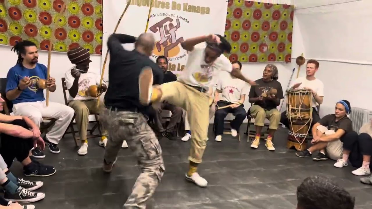 CM Chicago ( low country Capoeira Angola USA) and aluna Anapaz (angoleiros de Kanaga).