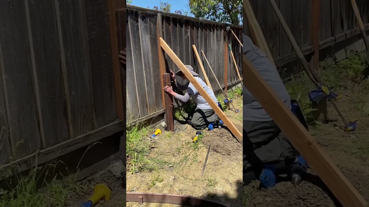 Fixing a rotten fence post.