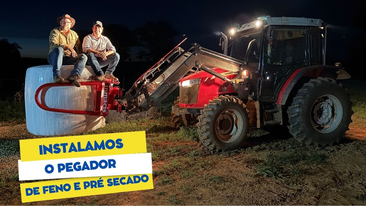 Parei de usar a paleteira para pegar os fardos cilíndricos de feno.