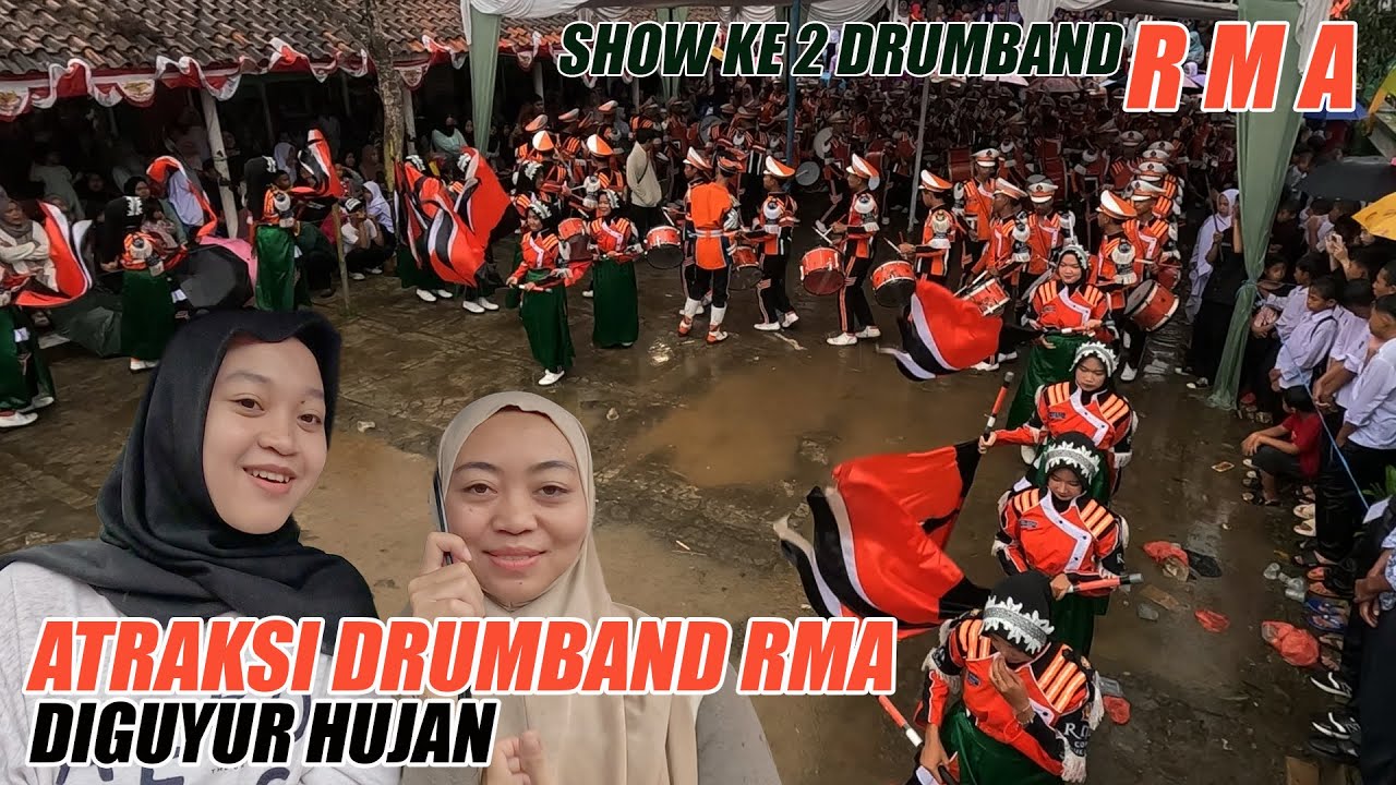 ATRAKSI DRUMBAND RMA DI GUYUR HUJAN