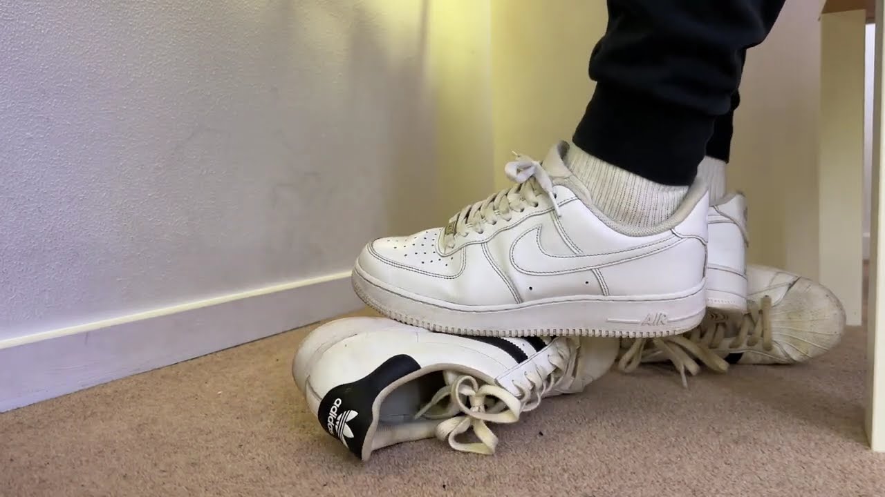 Nike Air Force 1 stomping Adidas sneakers