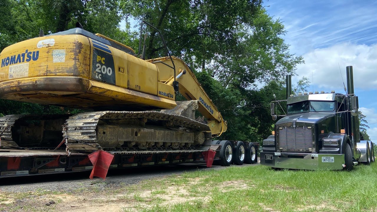 hauling KOMATSU excavator, RGN lowboy trucking | Kenworth with LOUD 8in straight pipes
