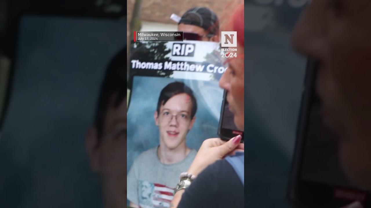 Person Holds Sign Outside RNC Calling Thomas Matthew Crooks A 'Hero'