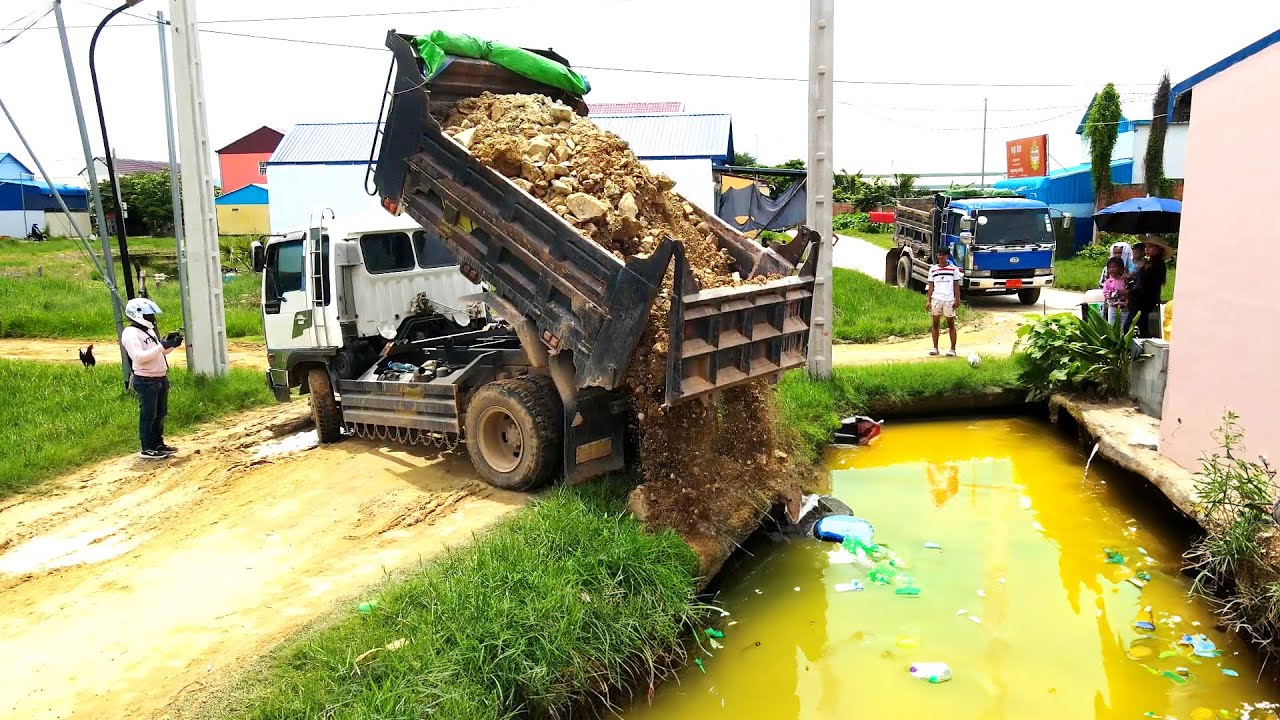 Completed the Project Pushing Rock to the Dirty Water, garbage and Aquatic plants By Bulldozer