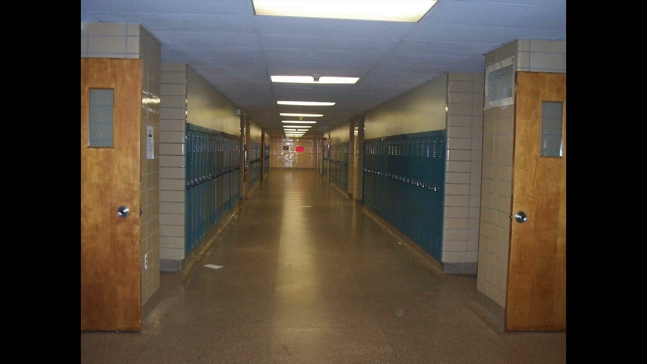 Fluorescent Lights buzzing over an empty hallway