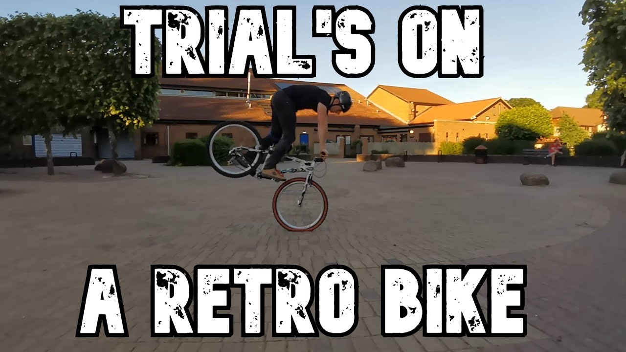 Riding a retro trials bike.
