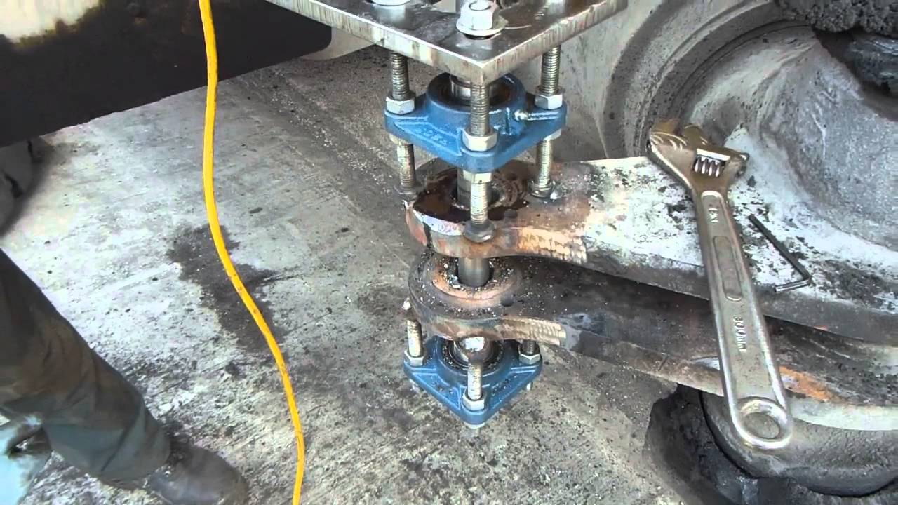 Repairing a worn container handler truck steer axle linkage using line boring