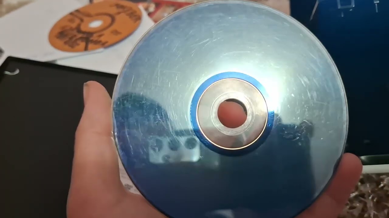 Put in random disc into portable dvd player 