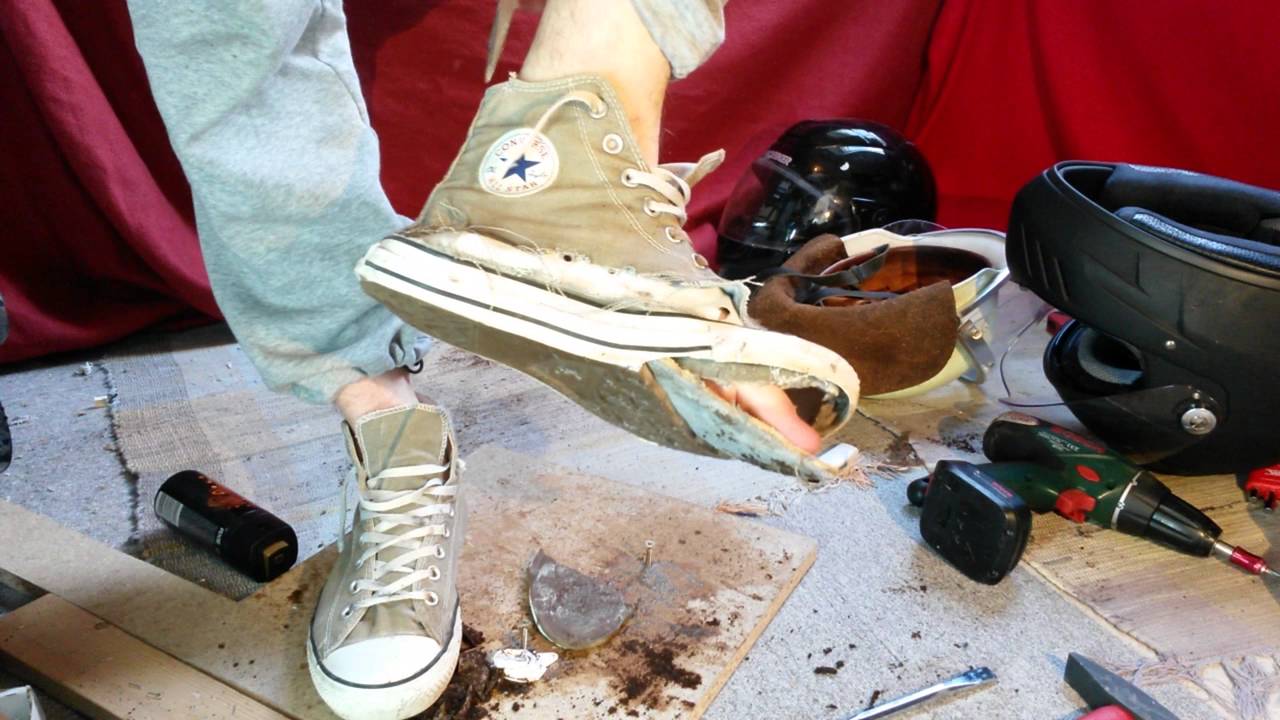 Gray Converse sneaker destroy #2 in motorcycle gear