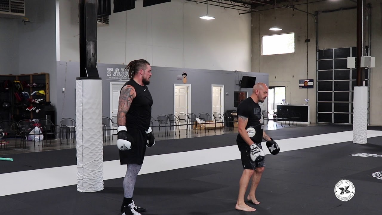 Coach Marc Montoya and Denver Bronco Derek Wolfe Training Session
