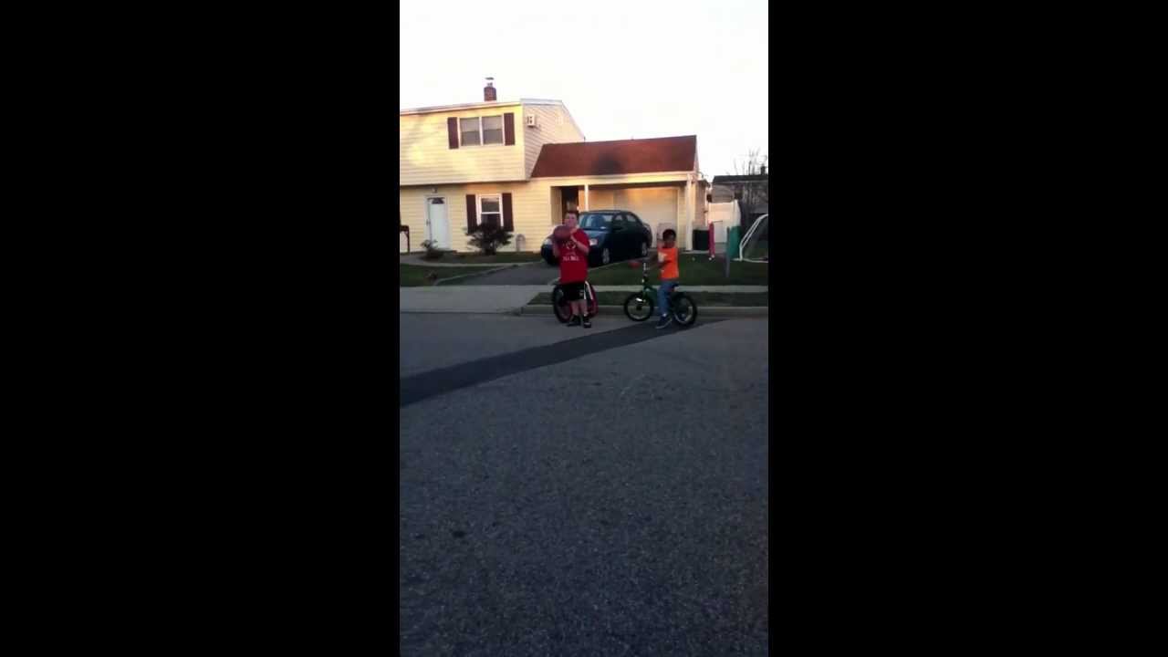 Kid gets hit by a car while playing basketball