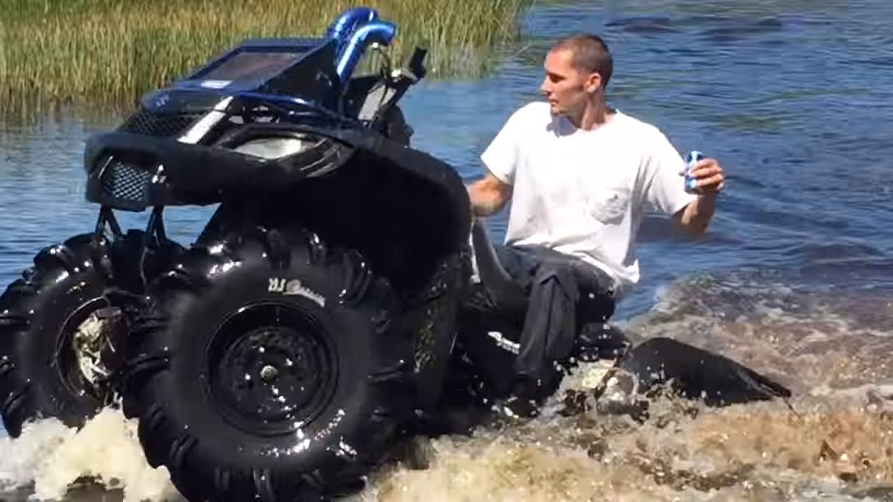 Suzuki King Quad 700 on 29.5 Outlaws Water Wheelies!