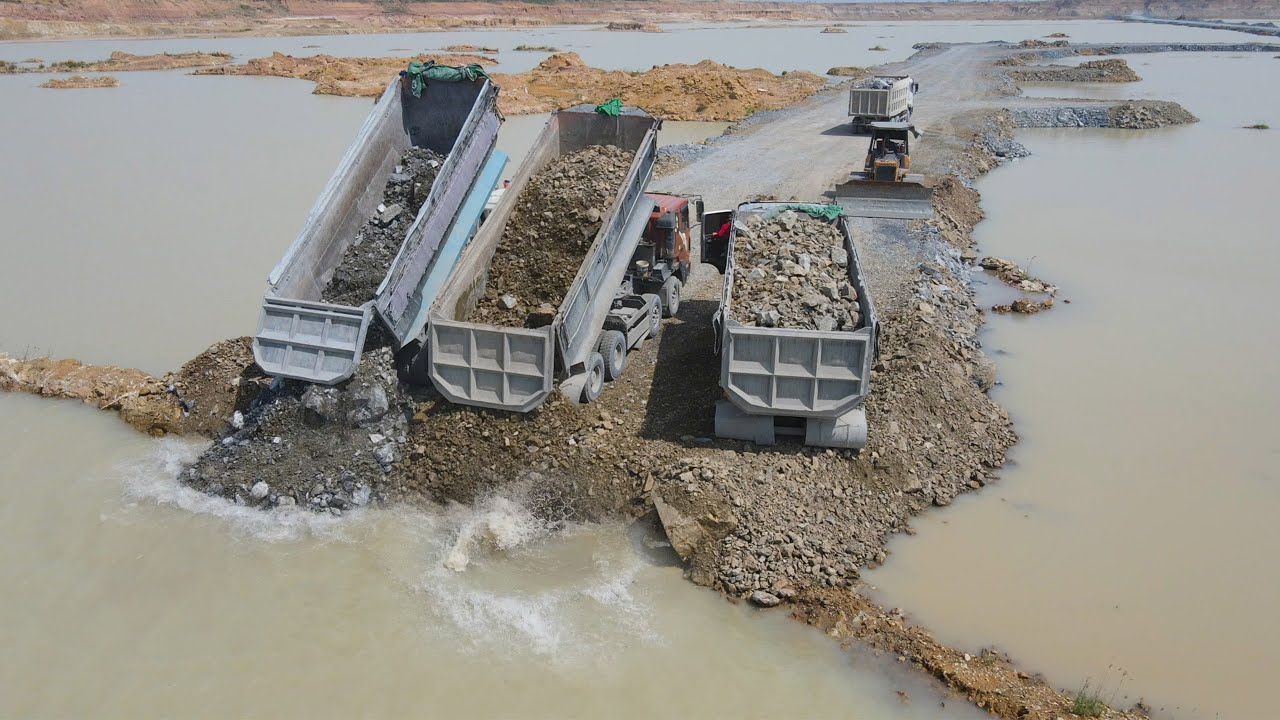 Wonderful Building Road On Water Construction By Bulldozer Pushing Stone with Truck Transport Stone
