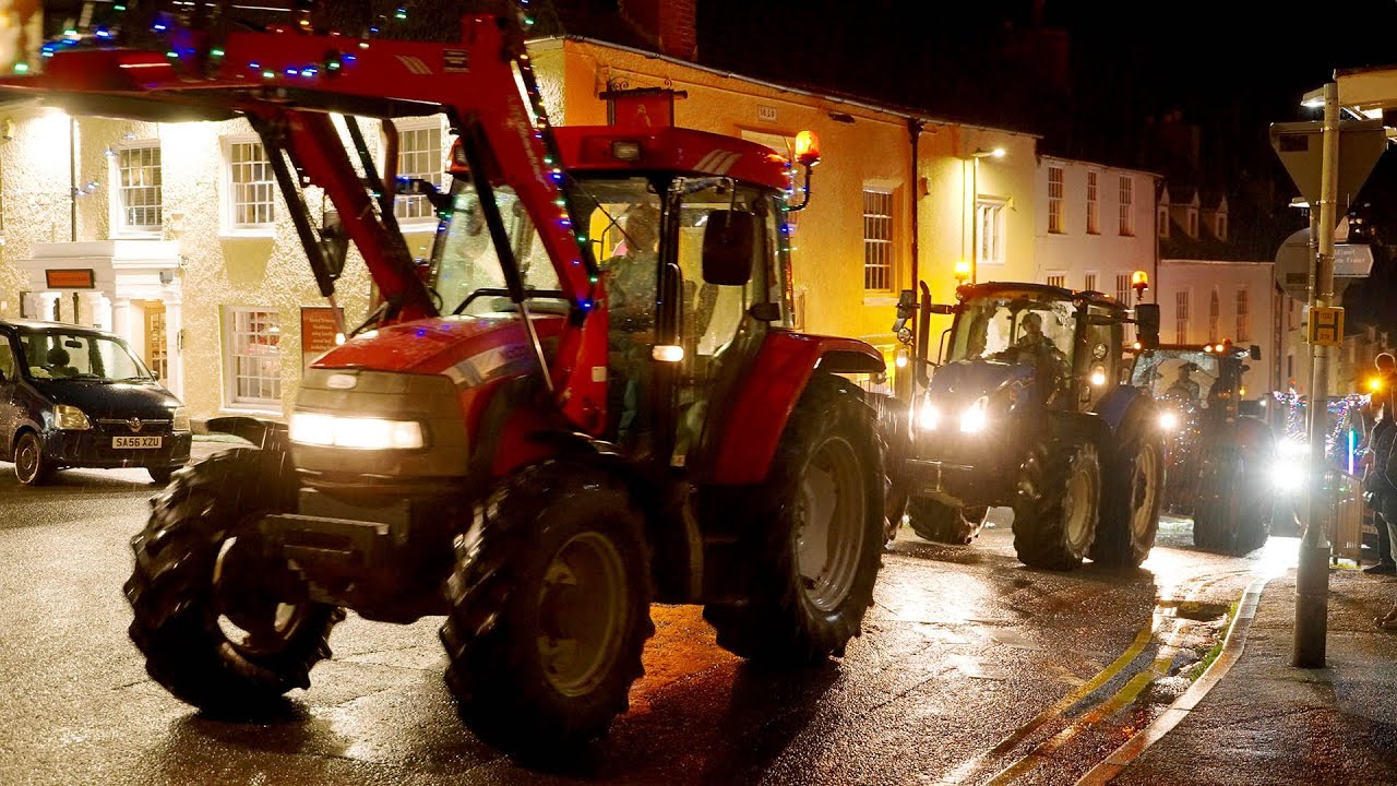 Hundreds of tractors head through the Cotswolds on a festive Christmas tractor run
