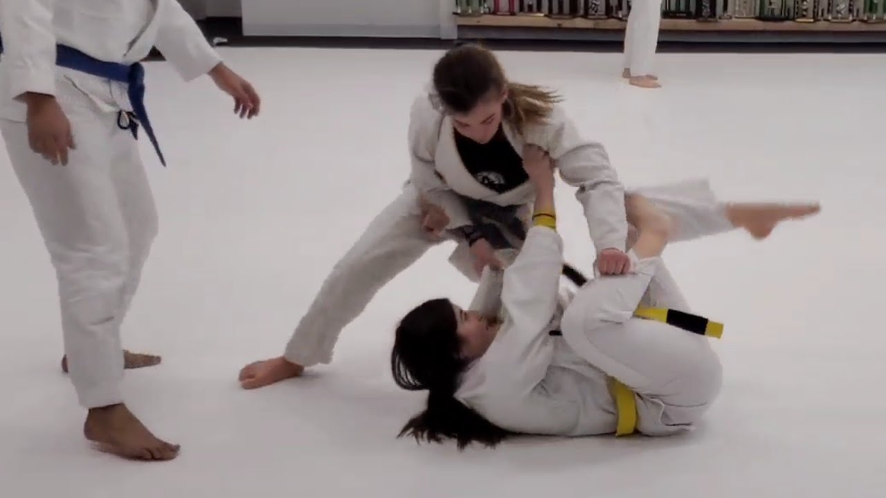 Emery Training- Rolling with a yellow belt