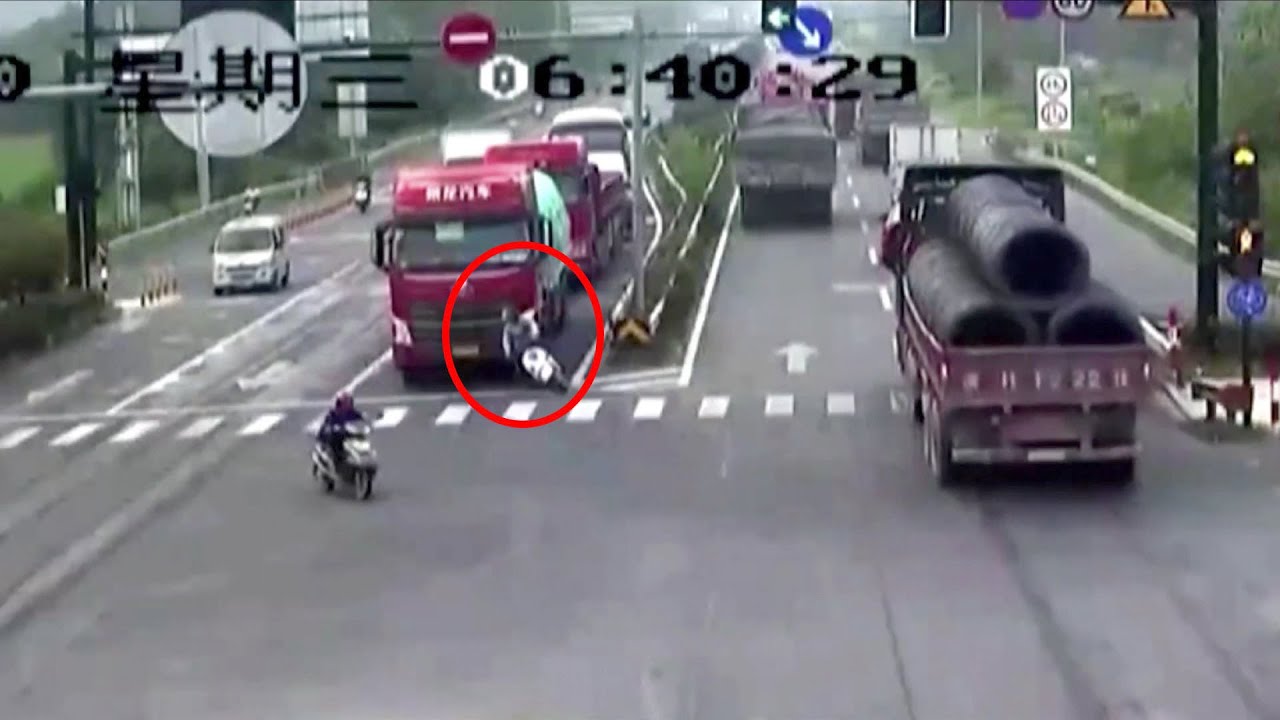 Scooter rider luckily survives being run over by truck