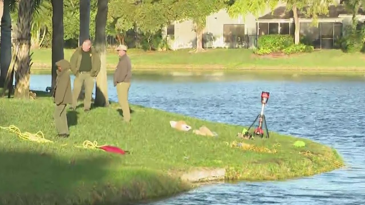 Divers with Broward Sheriff’s Office continue searching Deerfield Beach lake