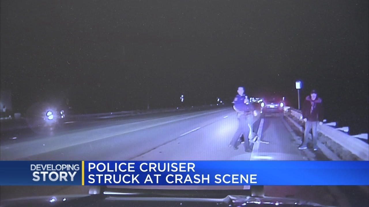 Police cruiser struck at crash scene