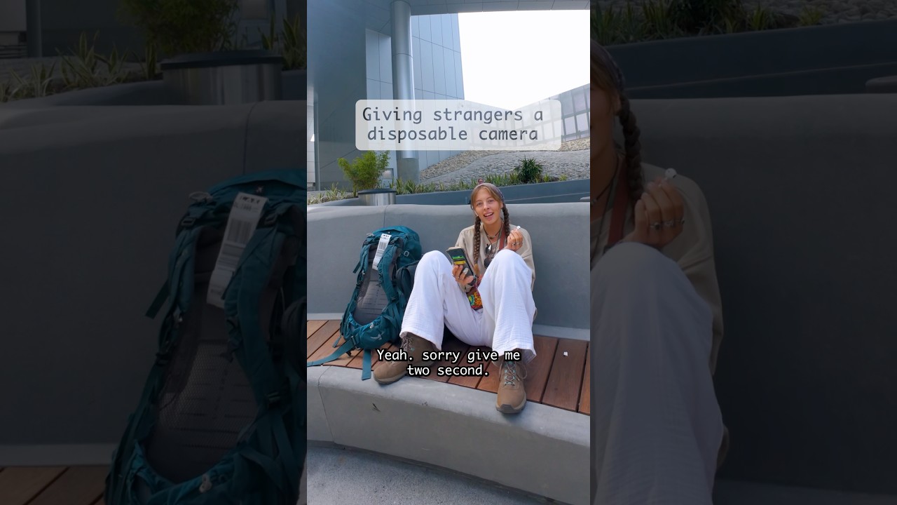 Giving strangers a disposable camera for her travels 