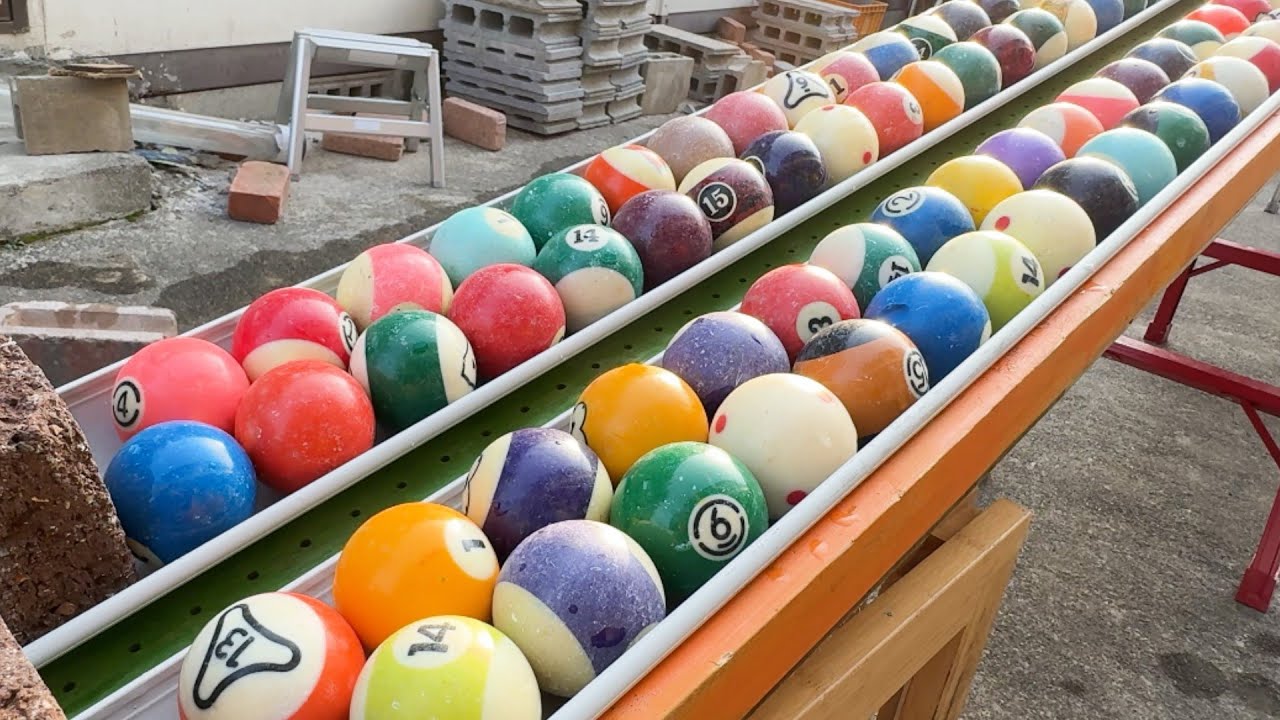Make a marble run course using a lot of billiard balls.  