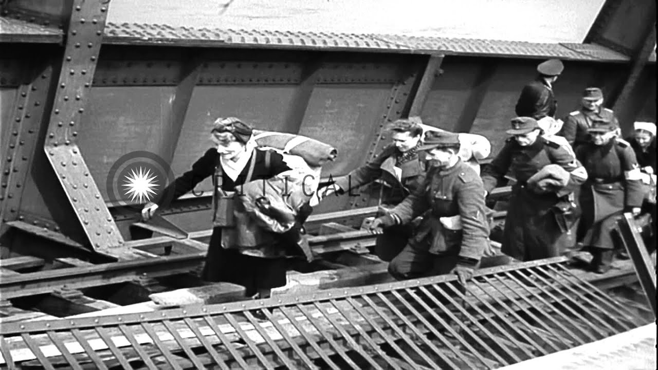 German civilians and officers walk along the Tangermunde Bridge during the Battle...HD Stock Footage