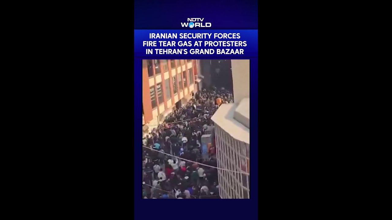 Iranian Security Forces Fire Tear Gas At Protesters in Tehran's Grand Bazaar