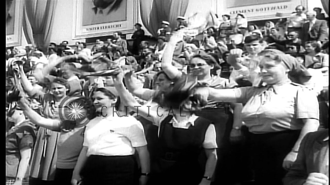 Marching workers and citizens salute German Democratic Republic President Wilhelm...HD Stock Footage