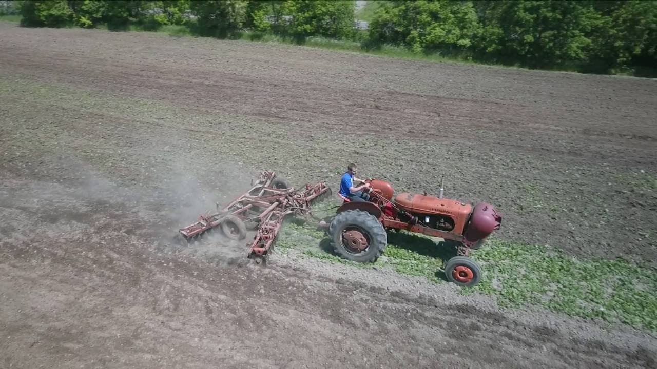 Allis Chalmer's WD-45 Working the field with a Snap Coupler Disc