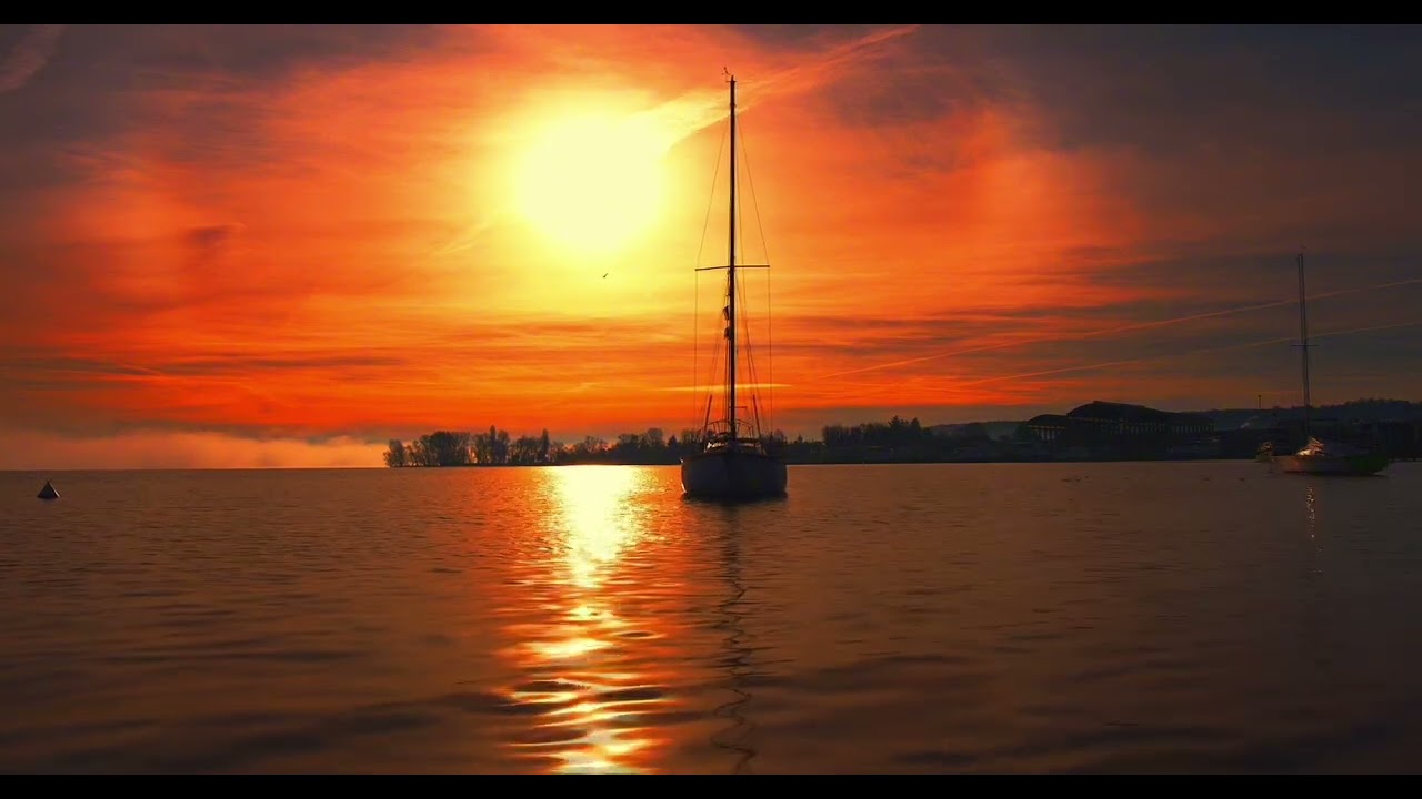 Golden Hour Sunset Over Calm Lake with Sailboat – 1 Hour Silent HD Ambience