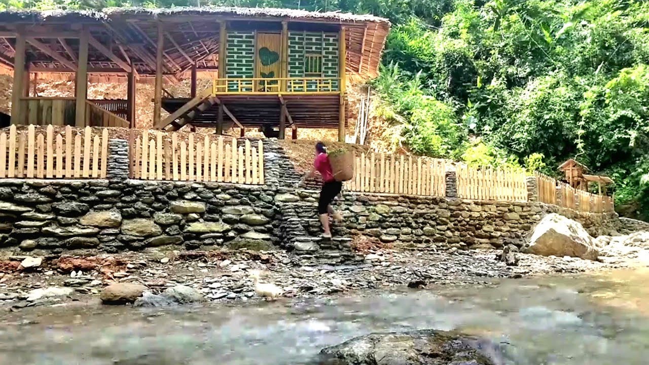 The young woman built her dream house in the middle of the natural forest with her own hands