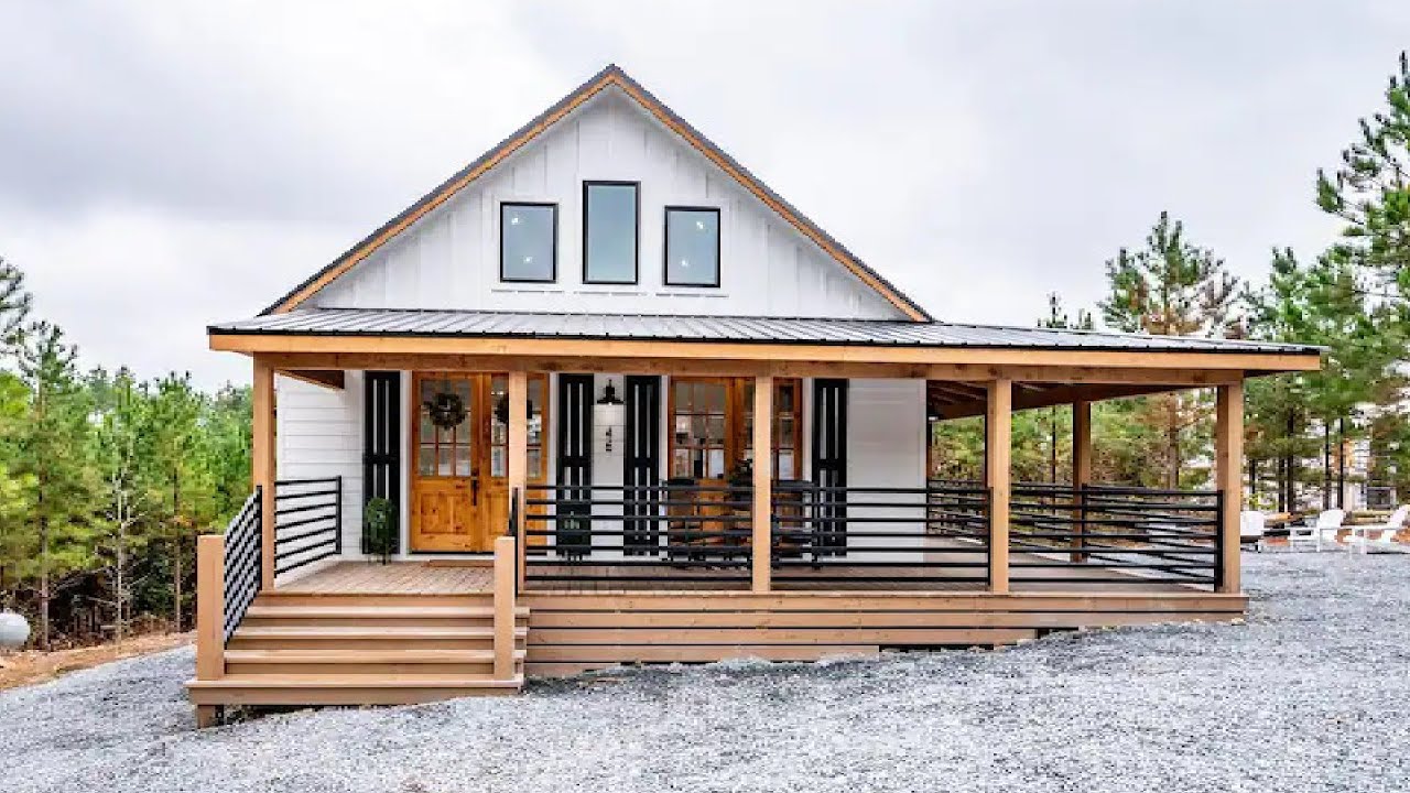 Modern Farmhouse with Spacious Wrap-around Deck Amidst Peaceful Surroundings