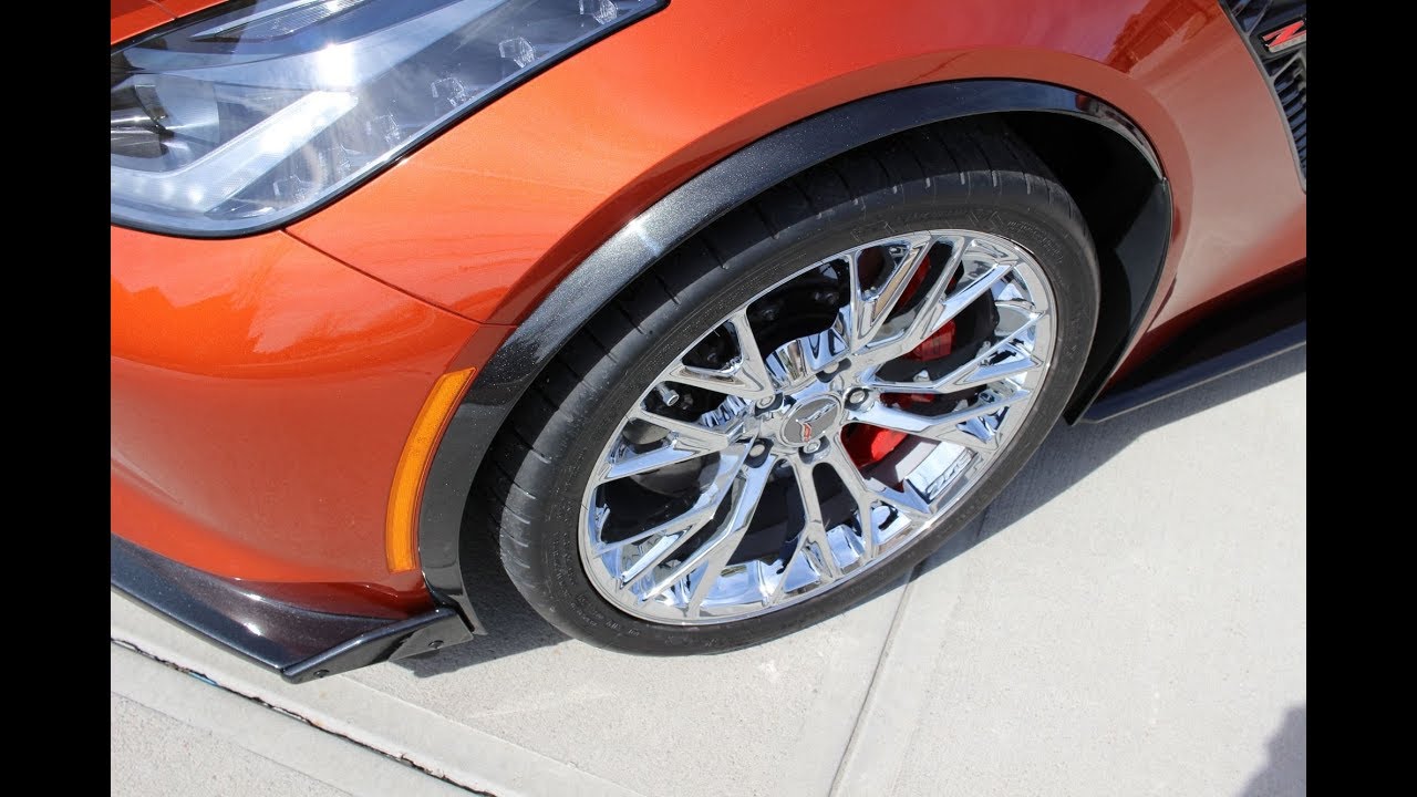 Installation of painted wheel opening moldings on the Z06 Corvette