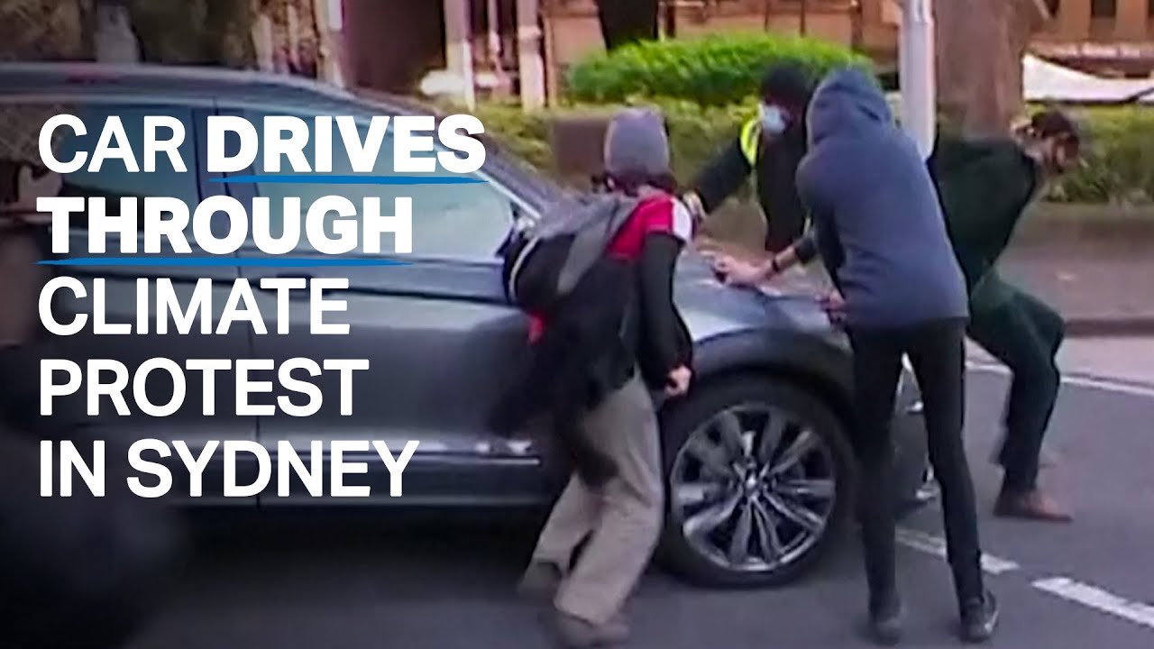 Car almost runs over climate protesters in Sydney, Australia