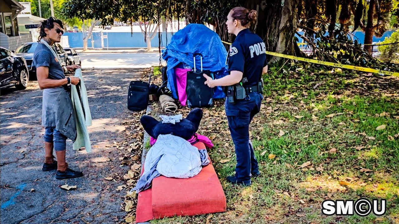 𝗡𝗢 𝗖𝗔𝗠𝗣𝗜𝗡𝗚 𝗜𝗡 𝗣𝗔𝗥𝗞: Officer Directs Unhoused Resident to Leave Camp Site Under Tree