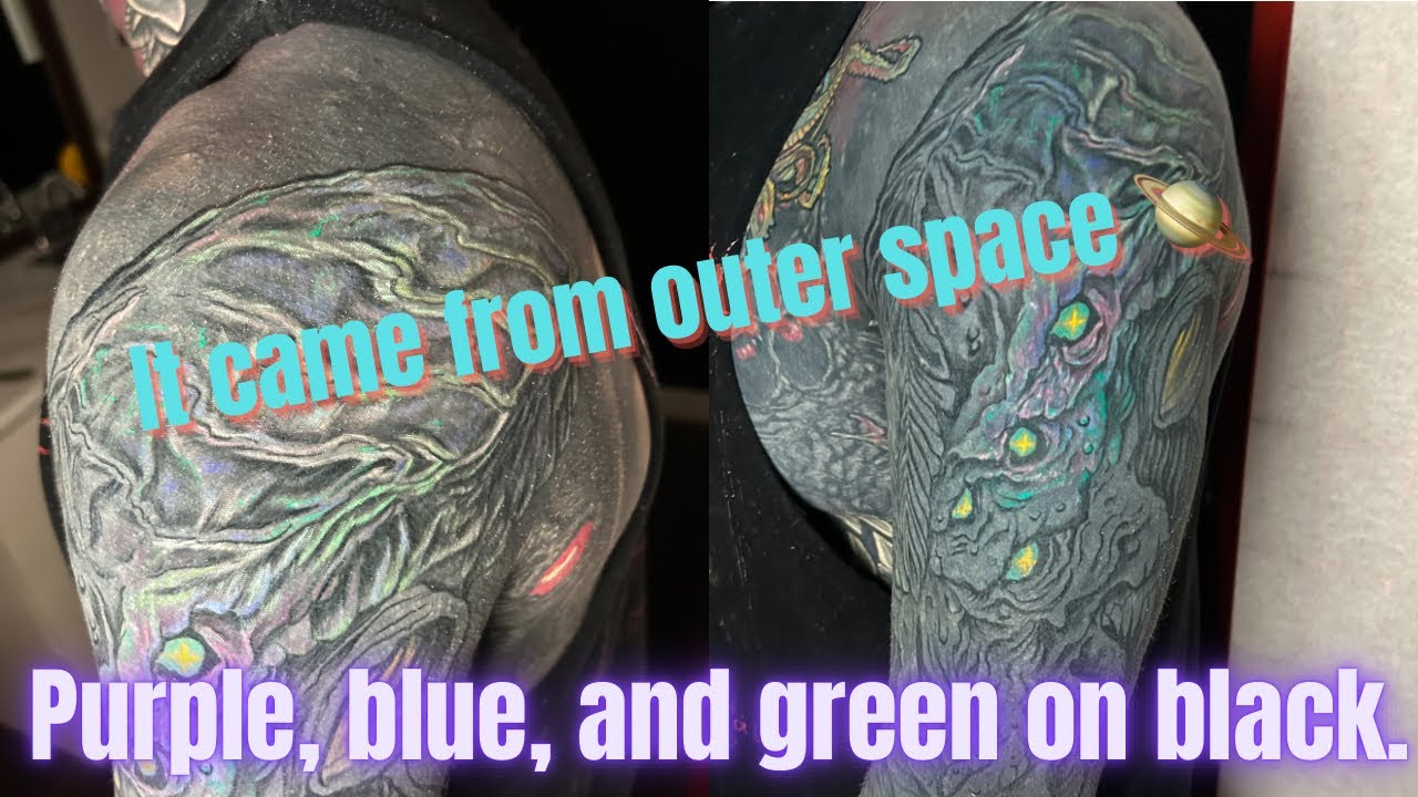 Blue, Pink, Purple, and Green on Blackout tattoo.