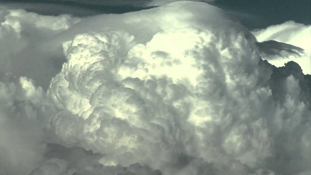 Giant Cloud Glide Through the Sky | Stock Videos Galore