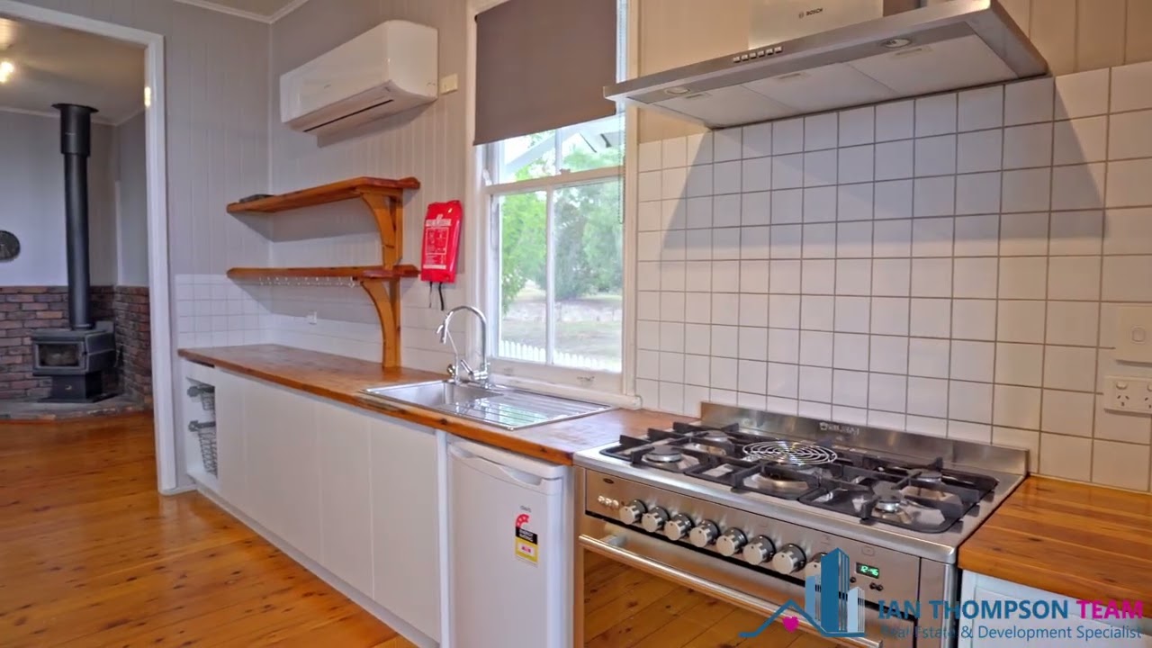 Fully Renovated Queenslander + Side access to 2 x 2.5 bay Garages + Great views